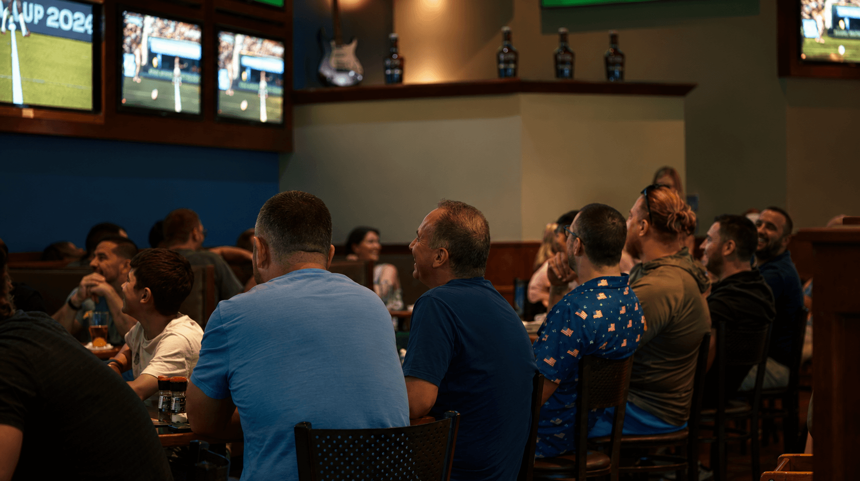 Guests at tables enjoying the game